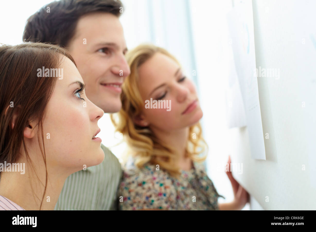 Female office worker at bulletin board hi-res stock photography and ...