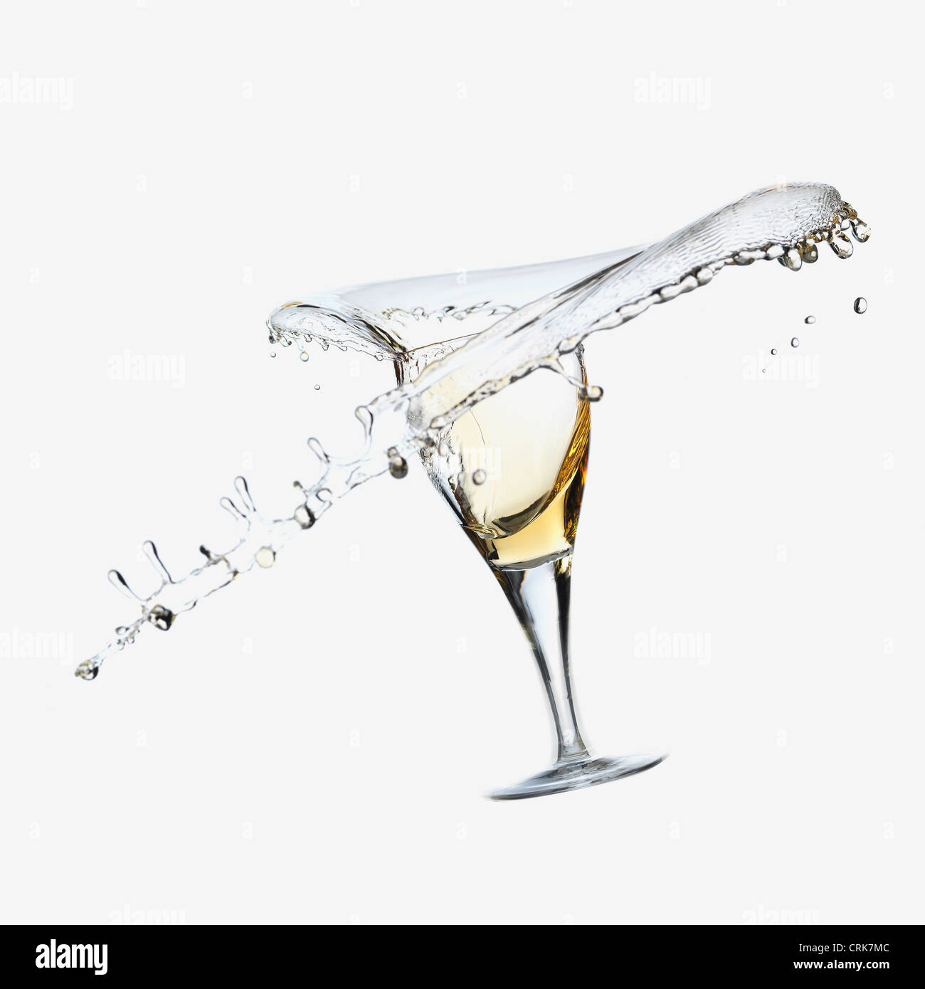 Wine splashing from glass Stock Photo