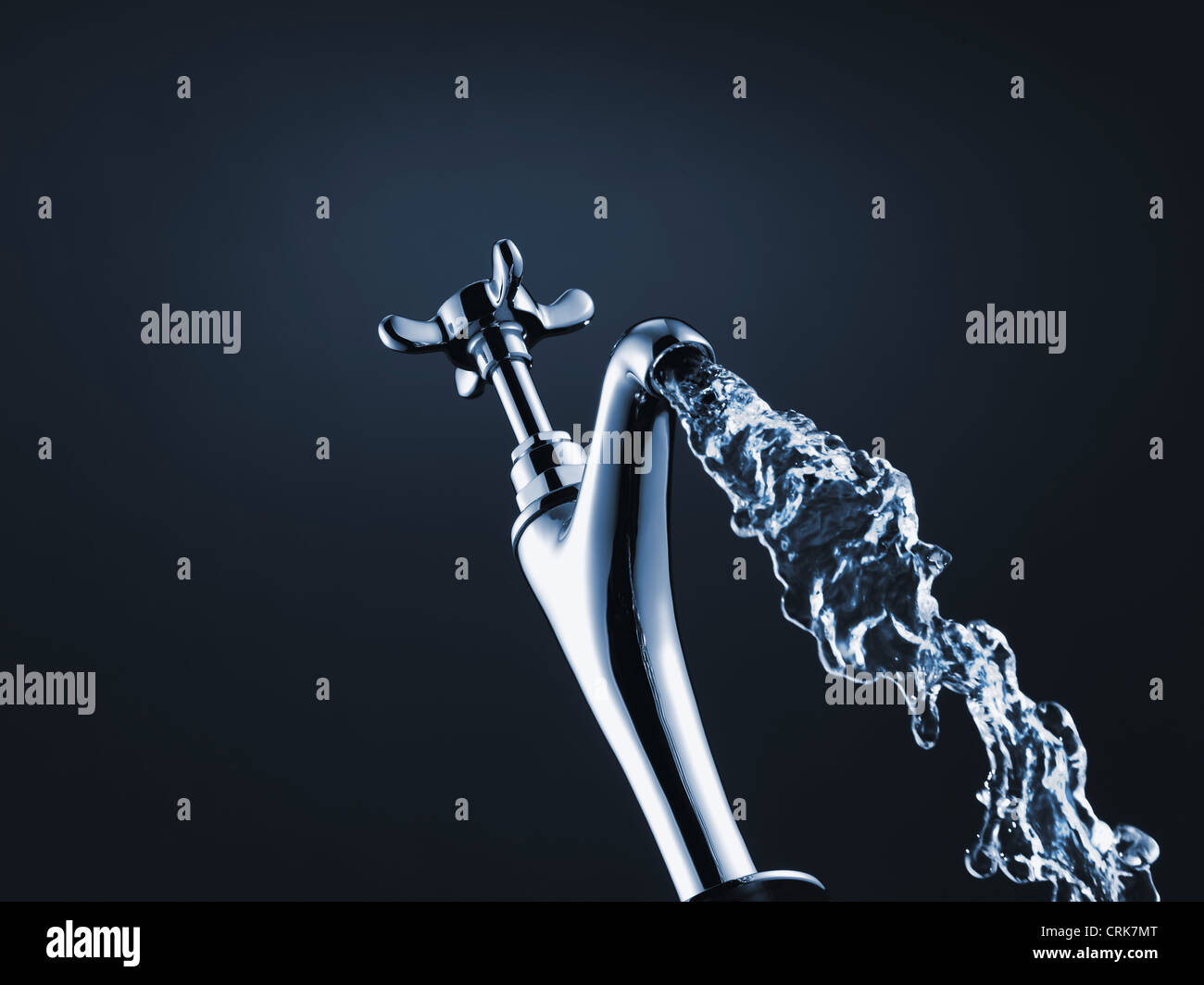 Close up of water pouring from faucet Stock Photo