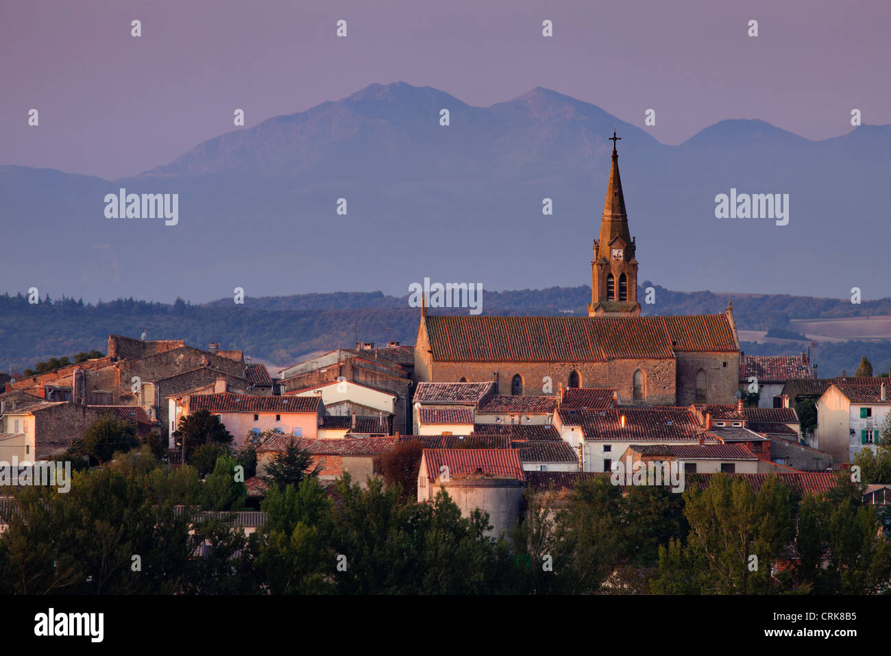 the village of Lasbordes at dawn, with the Pyrenees beyond, Aude, Languedoc-Roussillon, France Stock Photo