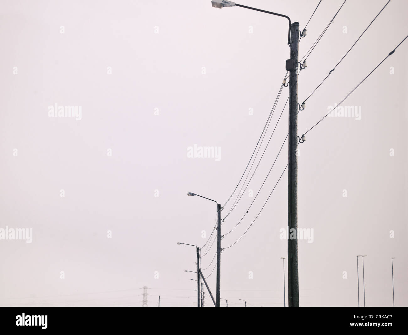 Street lights in snowy landscape Stock Photo