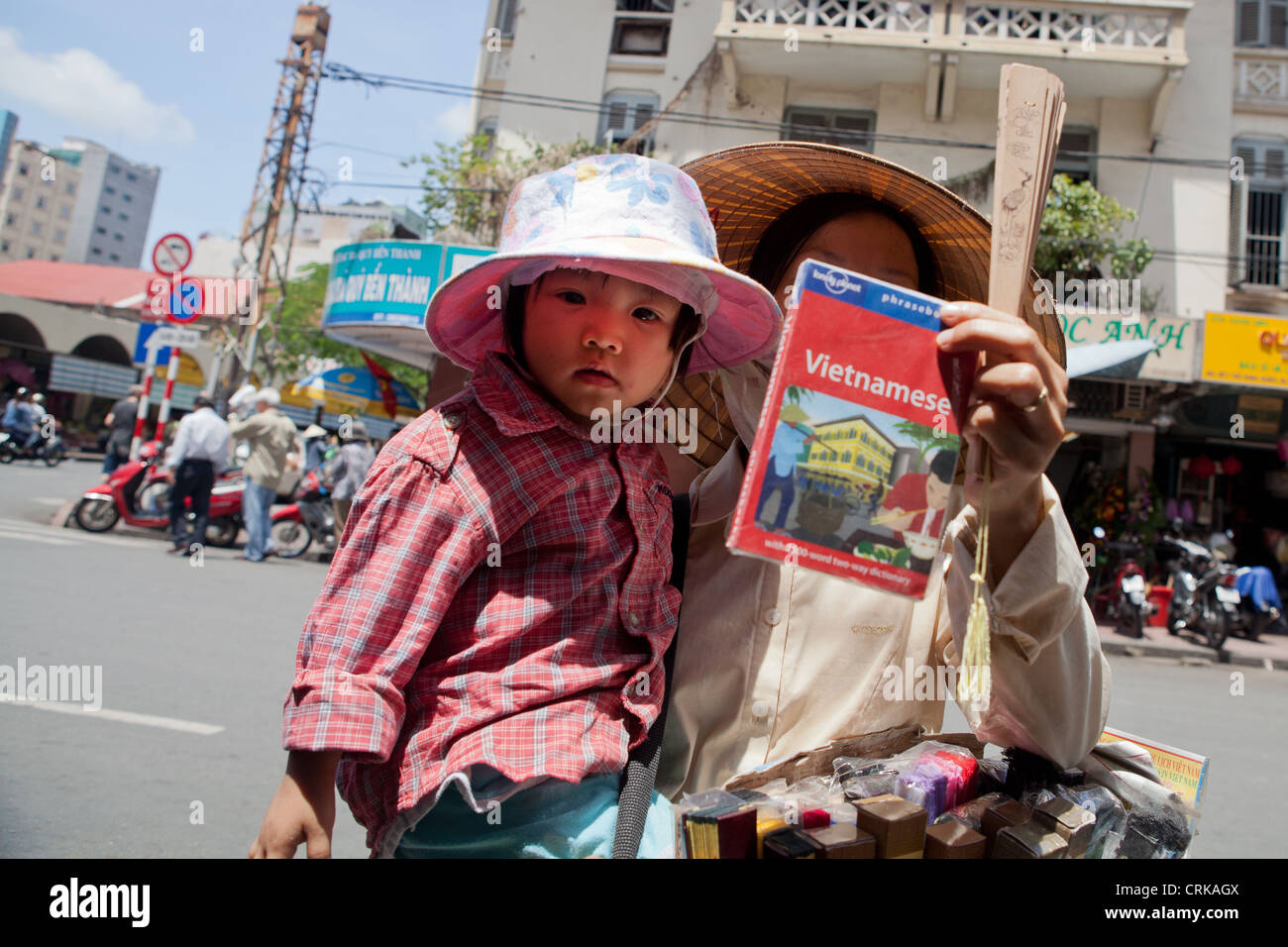 A lady with her daughter selling souvenirs for tourists near Ben Thanh in Dist. 1, HCMC, Vietnam Stock Photo