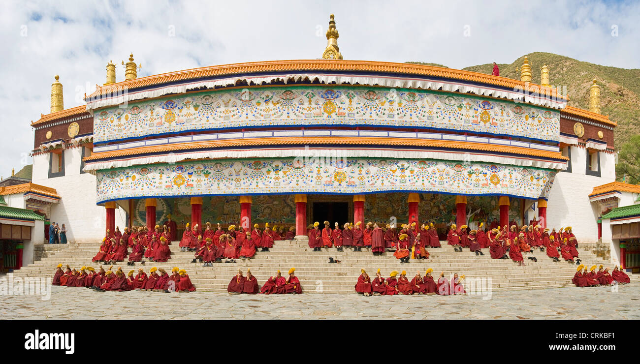 Tibetan Buddhist monks (Geluk or Yellow Hat) outside the Grand Sutra Hall of the Labrang Monastery before going in to prayer. Stock Photo