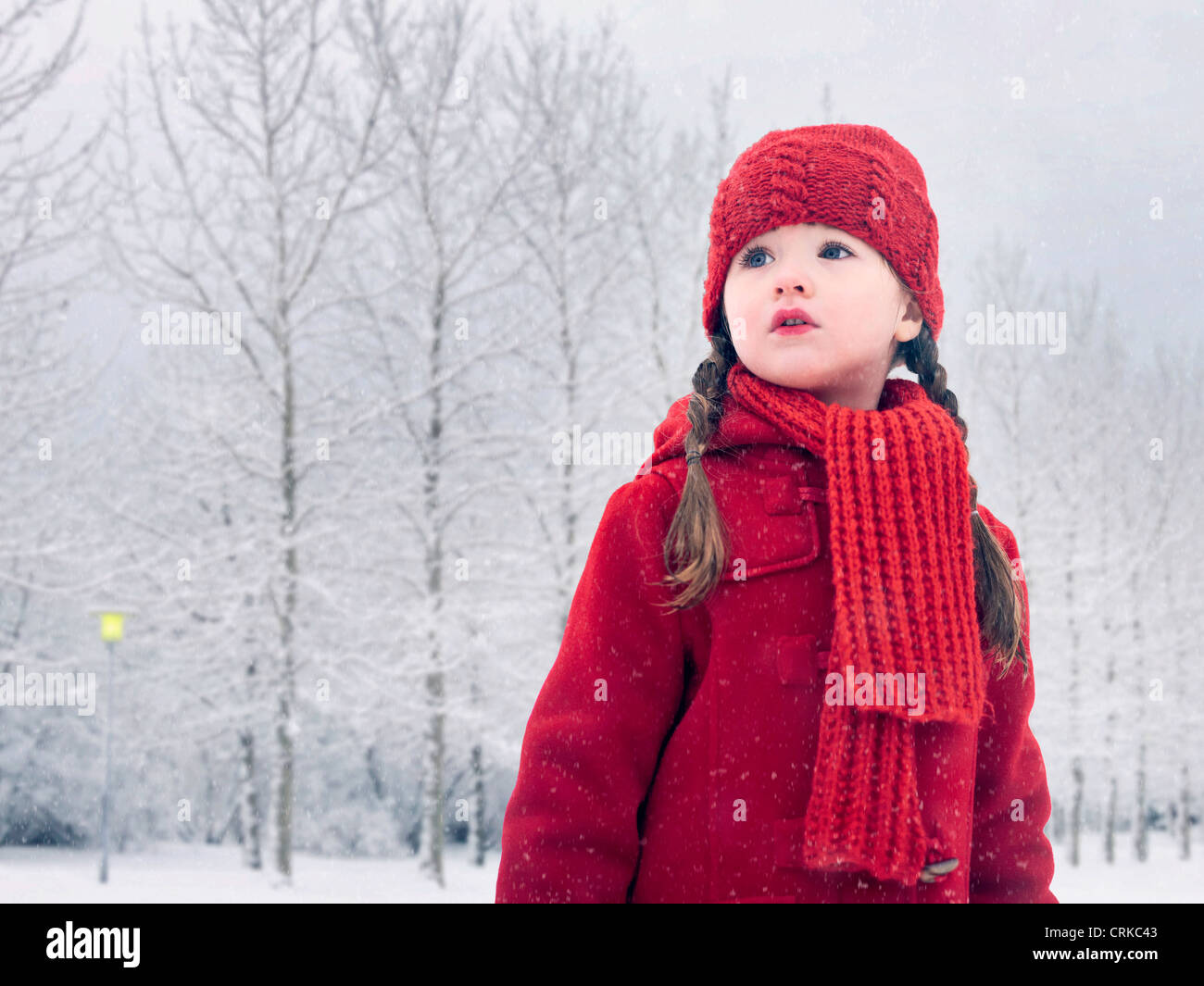 Girl walking in snow Stock Photo Alamy