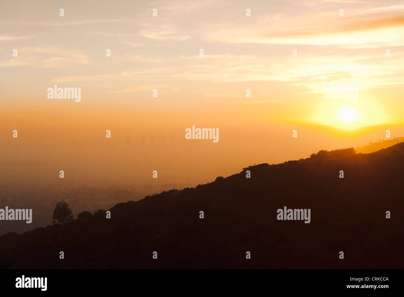 Silhouette of hillside at sunset Stock Photo