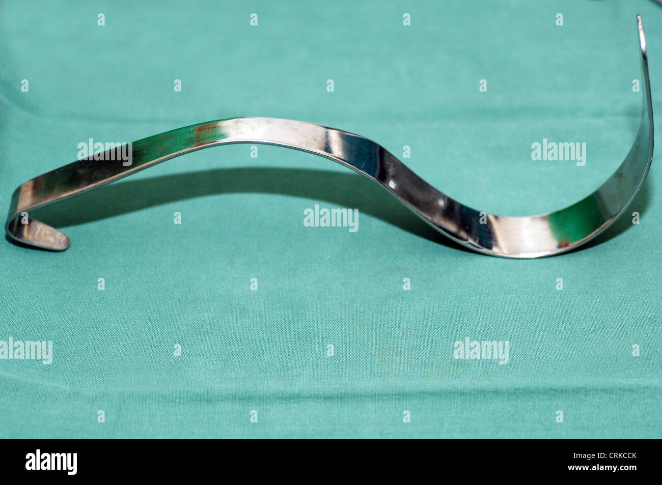 Retractors are surgical instruments for holding tissues away from the field of operation. Stock Photo