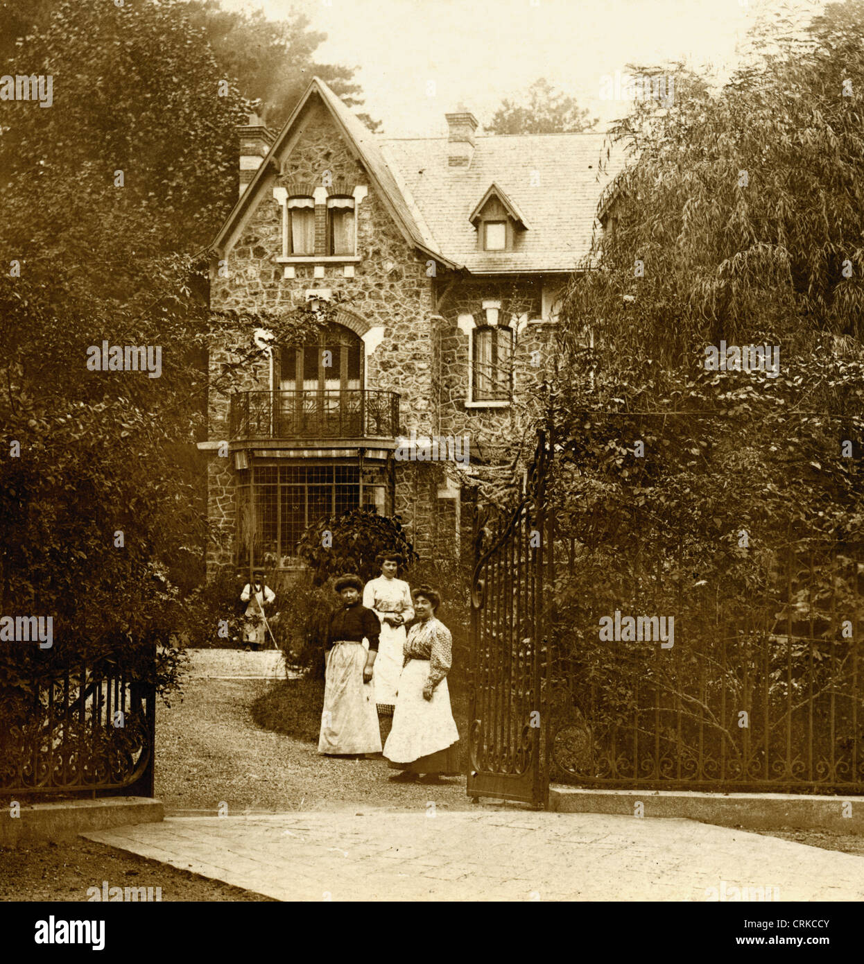 Household Staff in front of French Victorian Villa Stock Photo