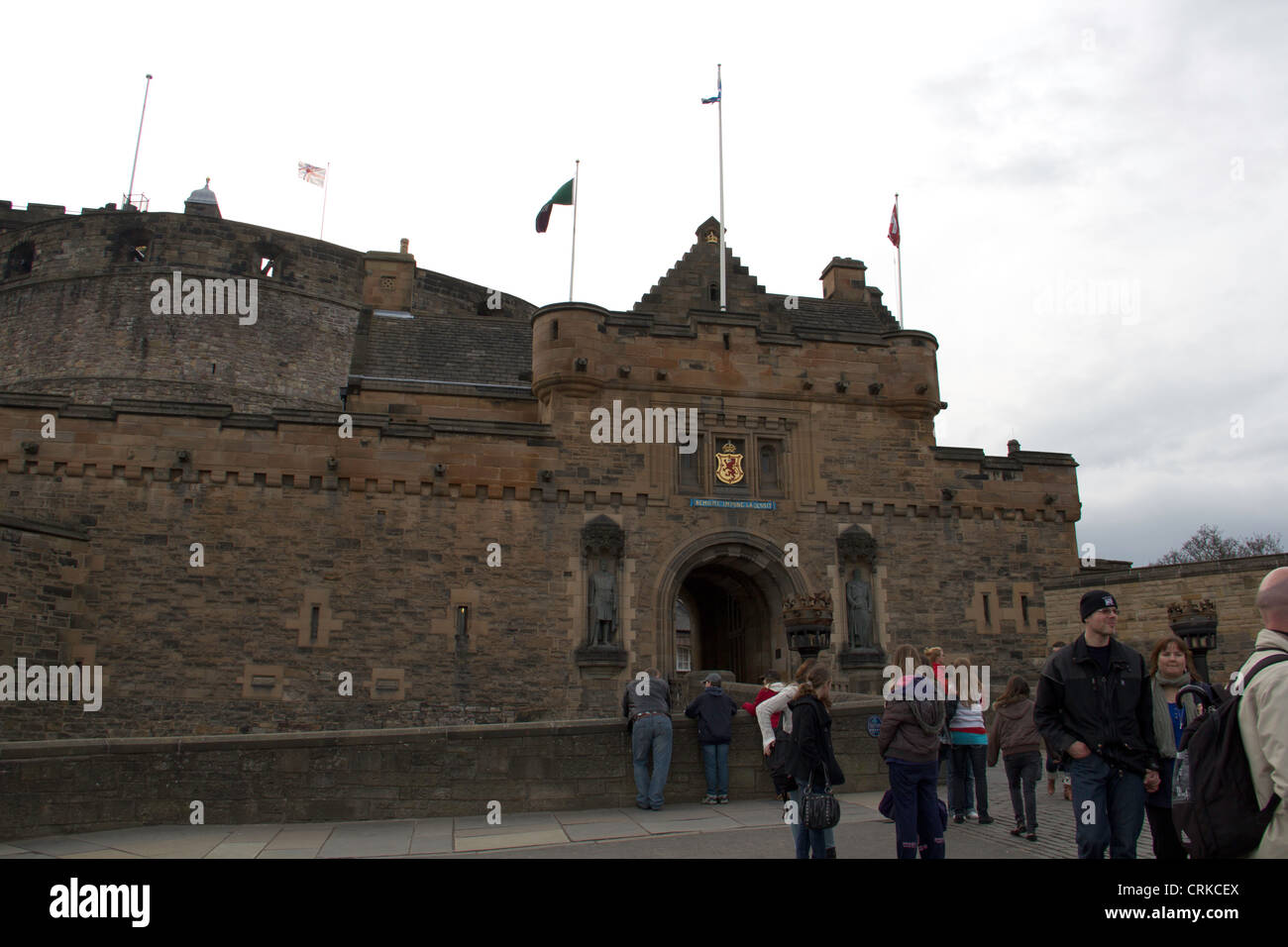 Tourists leaving and outside the Edinburgh Castle at sunset, after the time for visitors is over Stock Photo