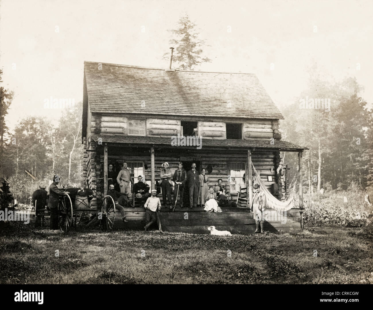 Group of Men at Log Cabin in the Adirondacks Stock Photo