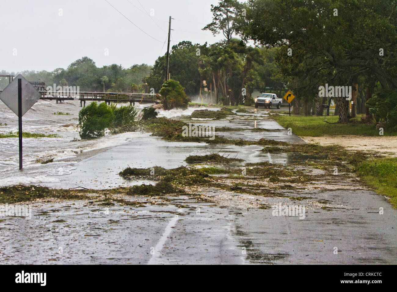Debris washed over the road as Tropical Storm Debby hits Cedar Key Florida Stock Photo
