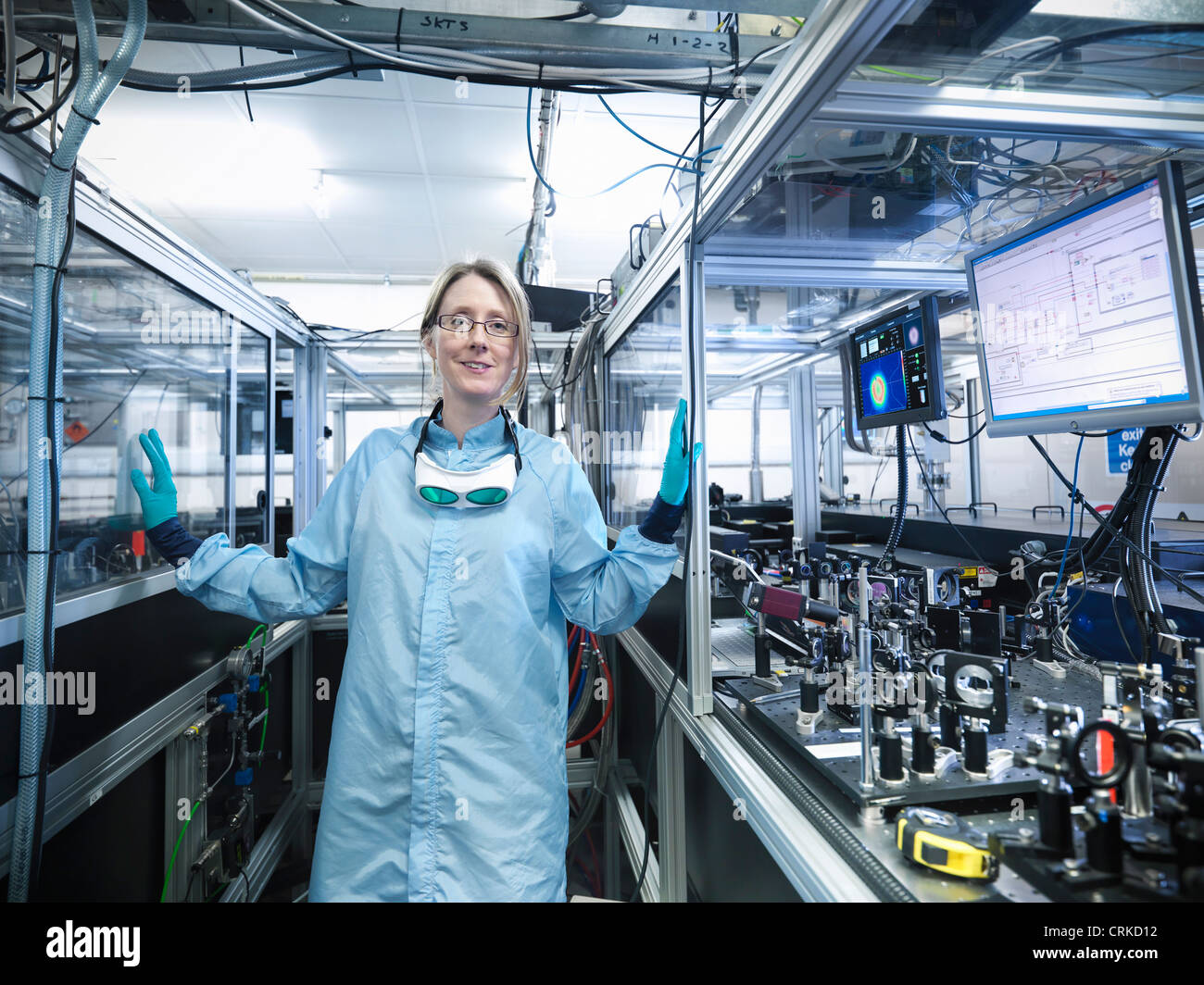 Scientist walking in lab Stock Photo