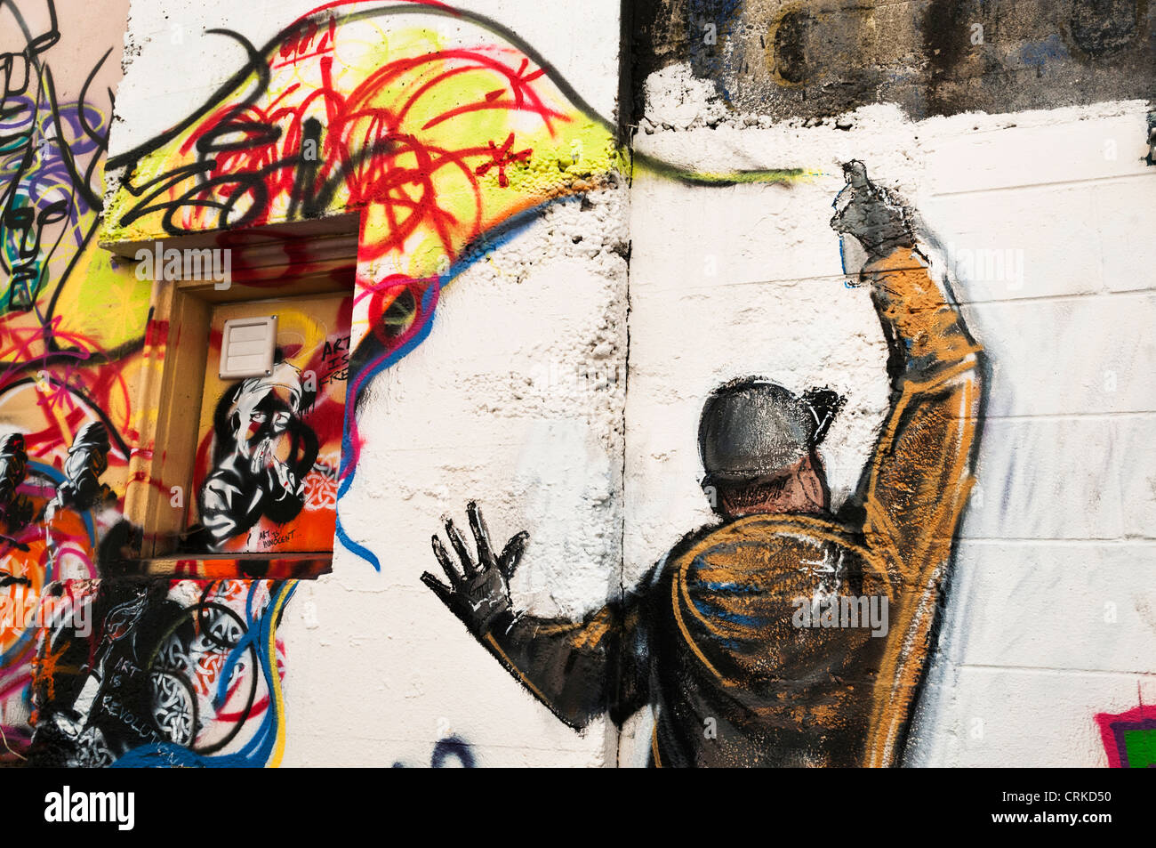 Graffiti of graffiti artist spray painting a wall in an alley in downtown  Aberdeen, Washington Stock Photo - Alamy