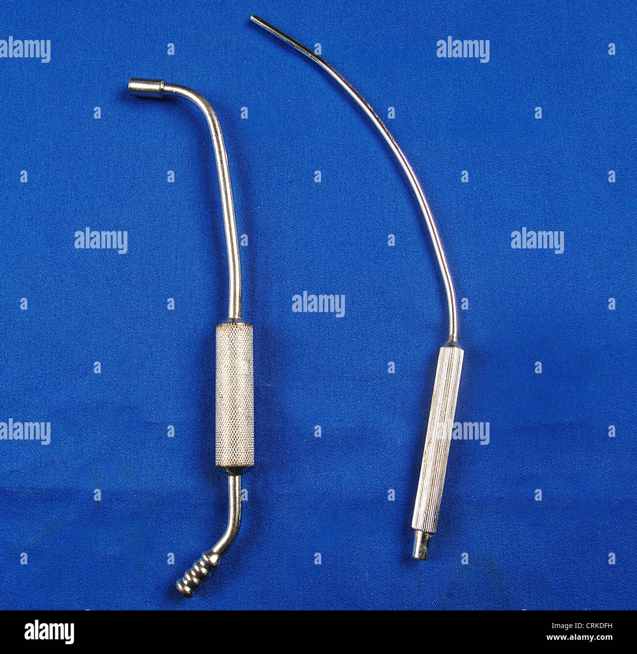 A narrow Frazier suction tip is seen here contrasted with a wider bore Ferguson abdominal suction tip. Stock Photo