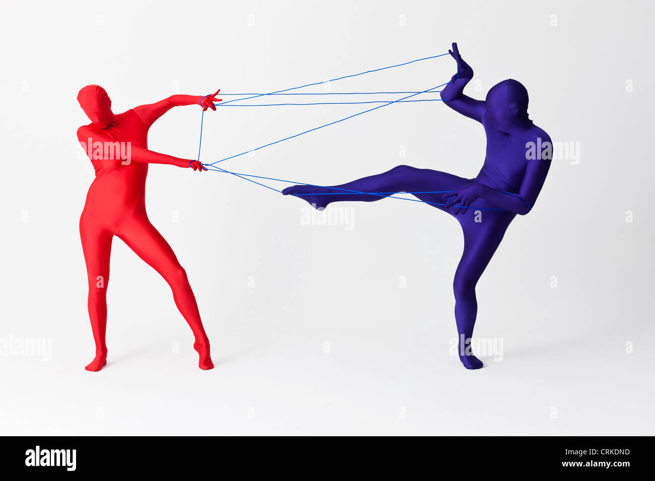 Couple in bodysuits playing with string Stock Photo