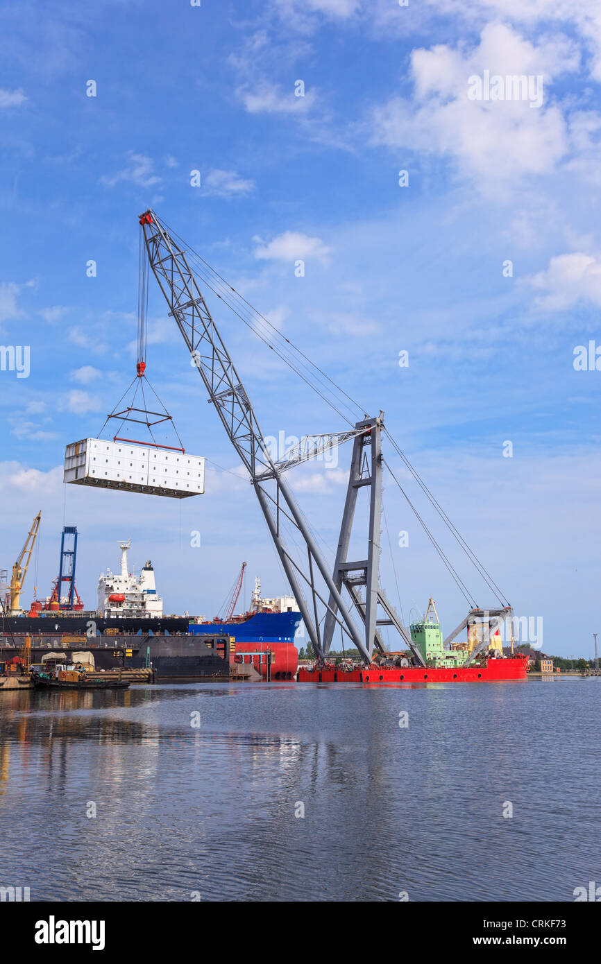 Heavy lifting floating crane vessel during operation. Stock Photo