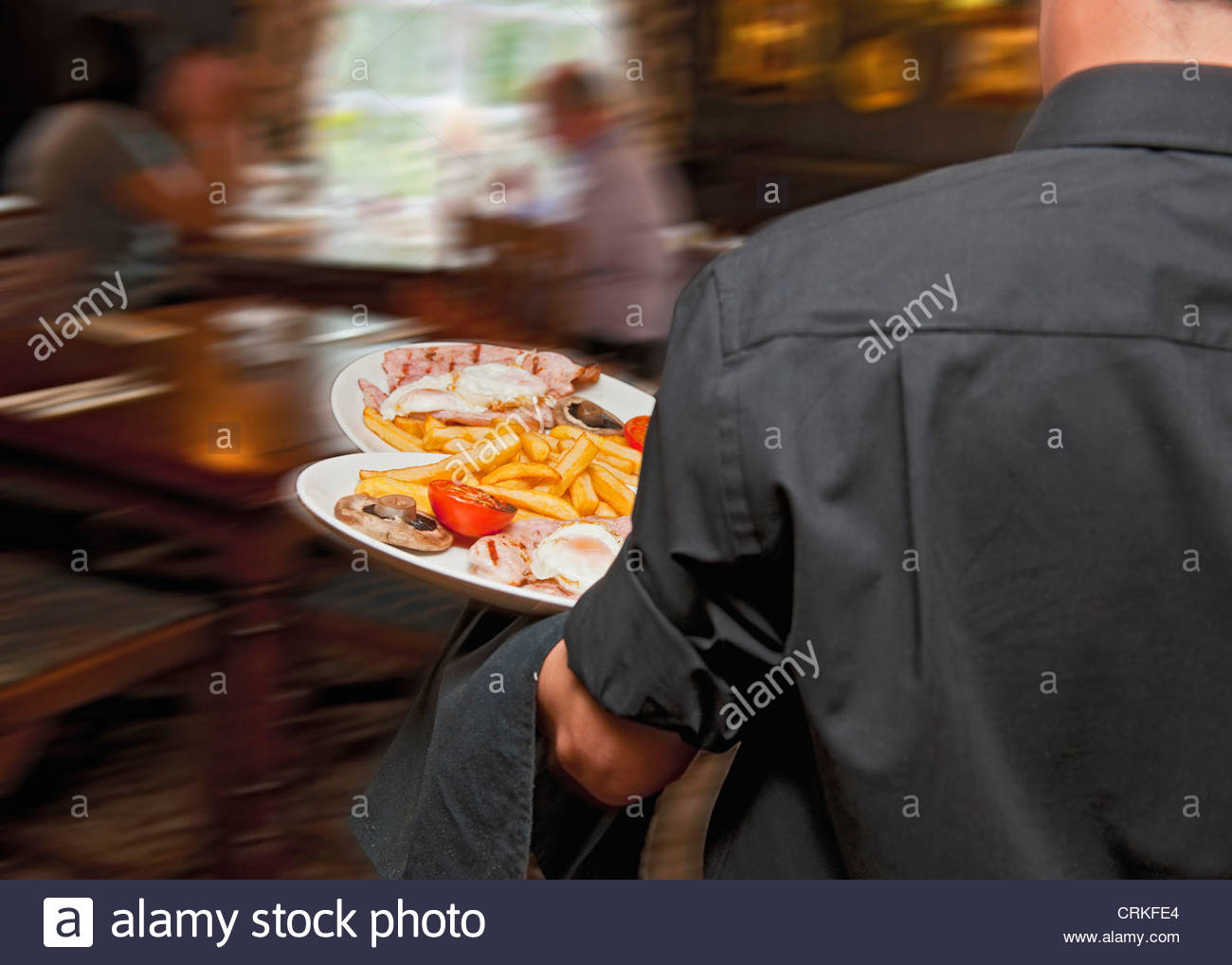 Waiter Serving Food Ethnic Stock Photos & Waiter Serving Food Ethnic
