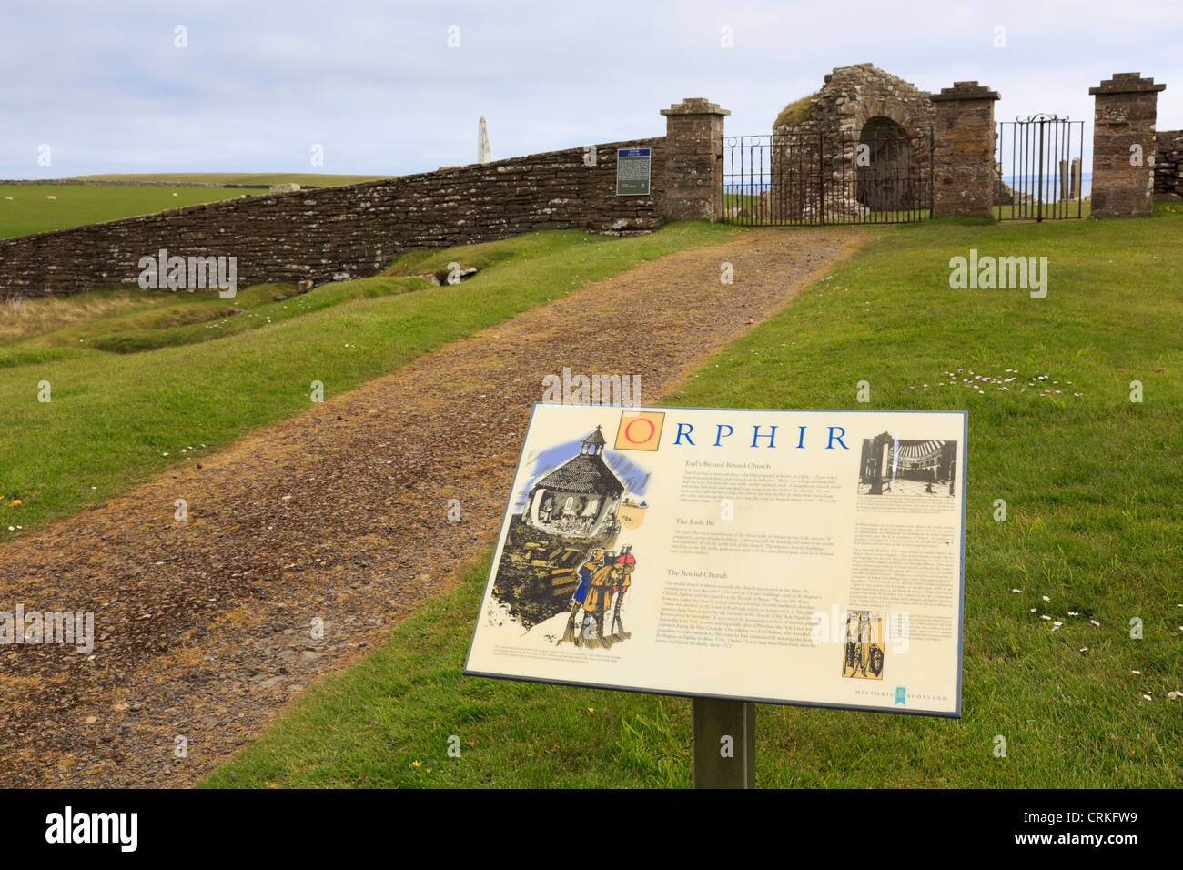 Visitor information sign describing ruins of 12th century Earl's Bu and Round Kirk (church of St Nicholas) Orphir Orkney Islands Stock Photo