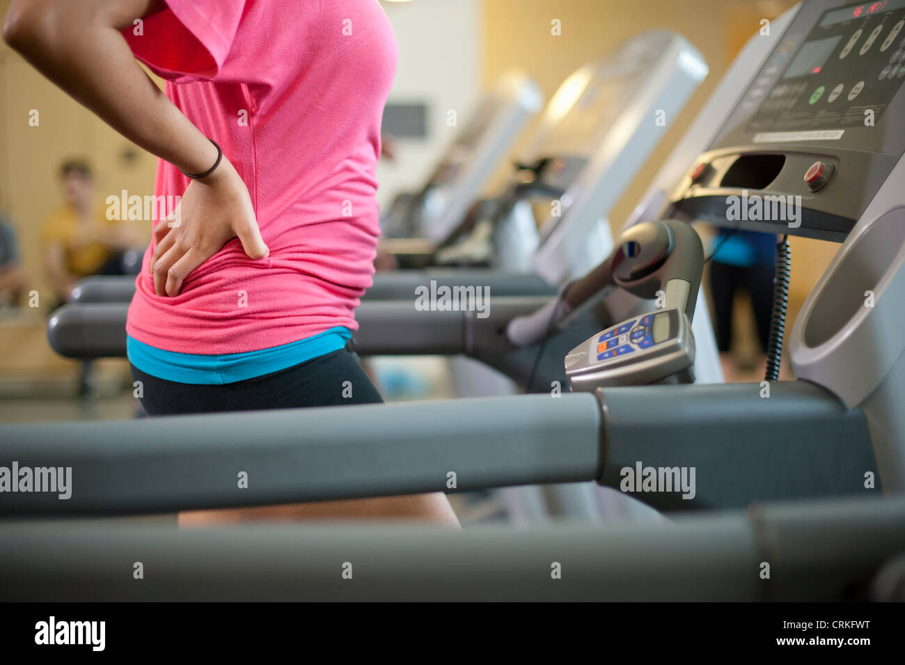 Woman using treadmill in gym Stock Photo Alamy
