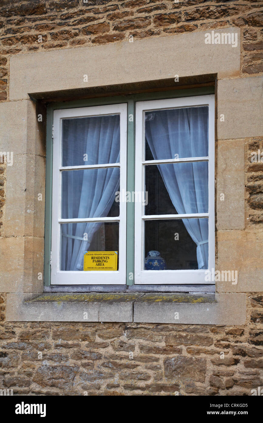 Sign in window of house at Lacock - Lacock Tenants Association residents parking area visitors use car park provided at Lacock, Wiltshire, UK in April Stock Photo