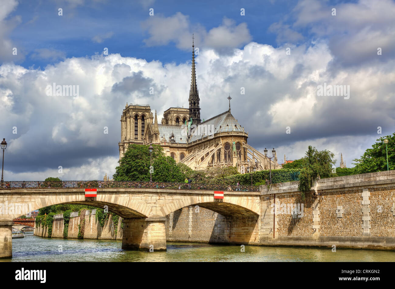 View on famous Notre Dame de Paris Cathedral under beautiful cloudy sky in Paris, France. Stock Photo