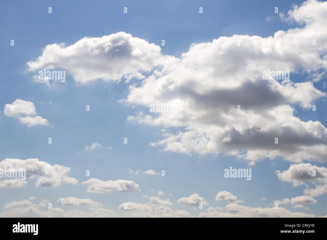 Background blue sky with white clouds on sunny day in summer - wide angle sky photo until horizon Stock Photo