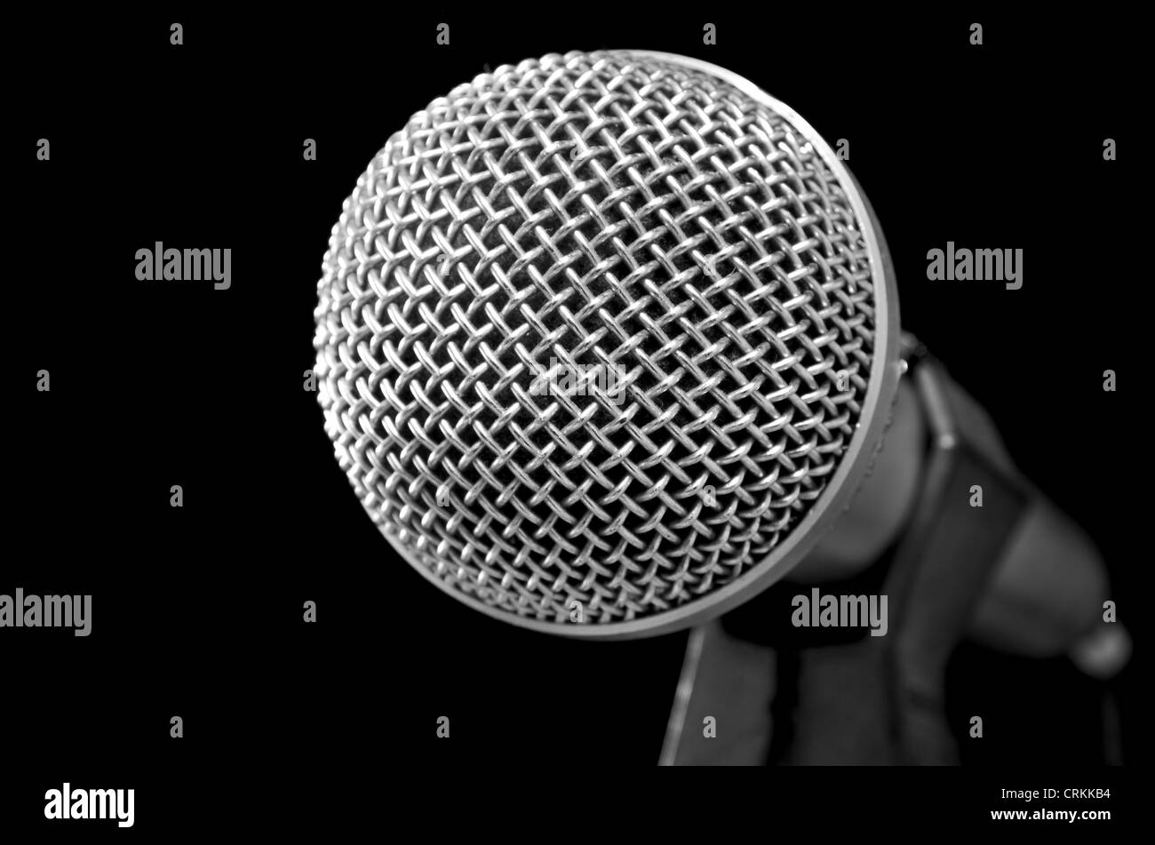 Silver shiny microphone on black Stock Photo