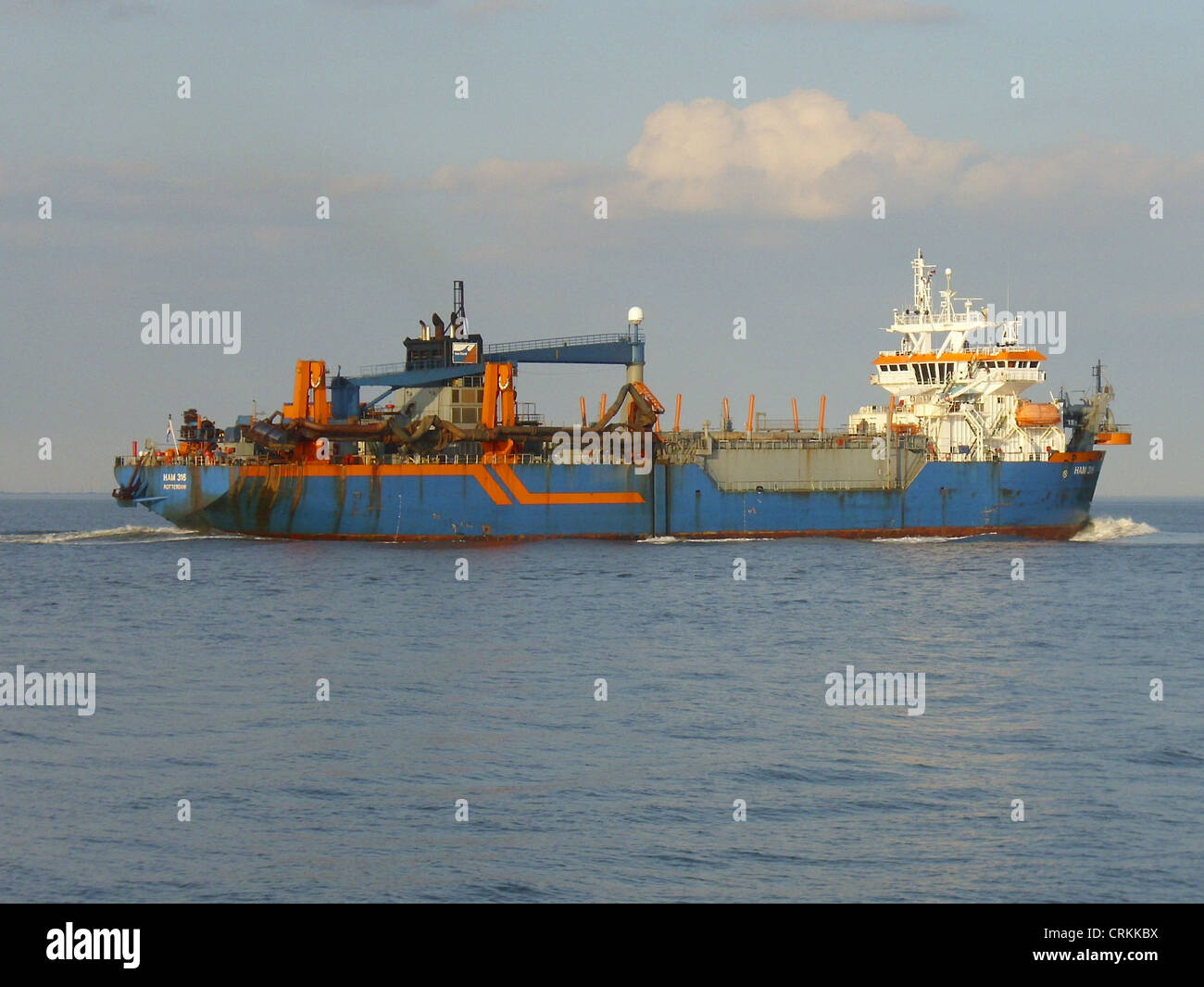 The trailing suction hopper dredger '''HAM 316''' inbound on the river Elbe Stock Photo