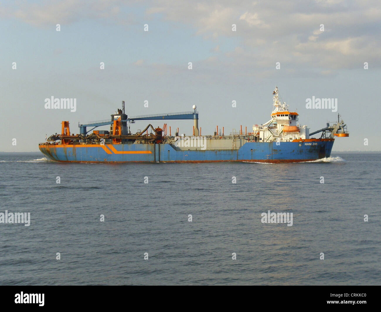 The trailing suction hopper dredger '''HAM 316''' inbound on the river Elbe Stock Photo
