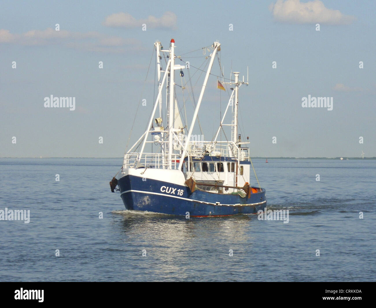 The fishing vessel '''CUX 18 Goedeke Michel''' with home port Cuxhaven outbound on the Elbe rive Stock Photo