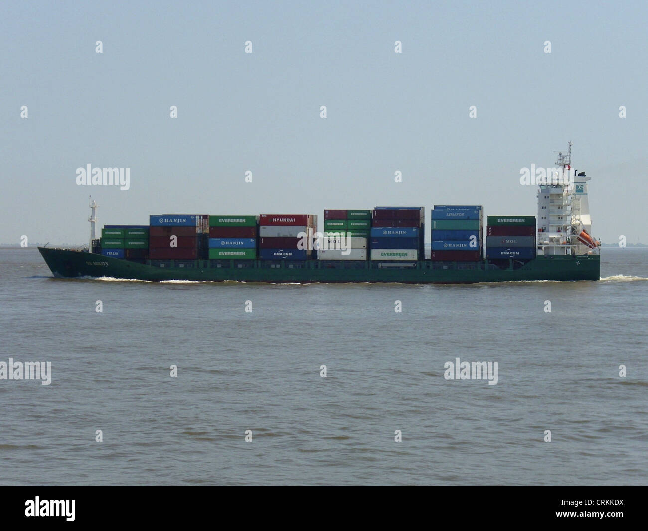 The feeder ship '''DS Agility''' outbound on the Elbe river Stock Photo