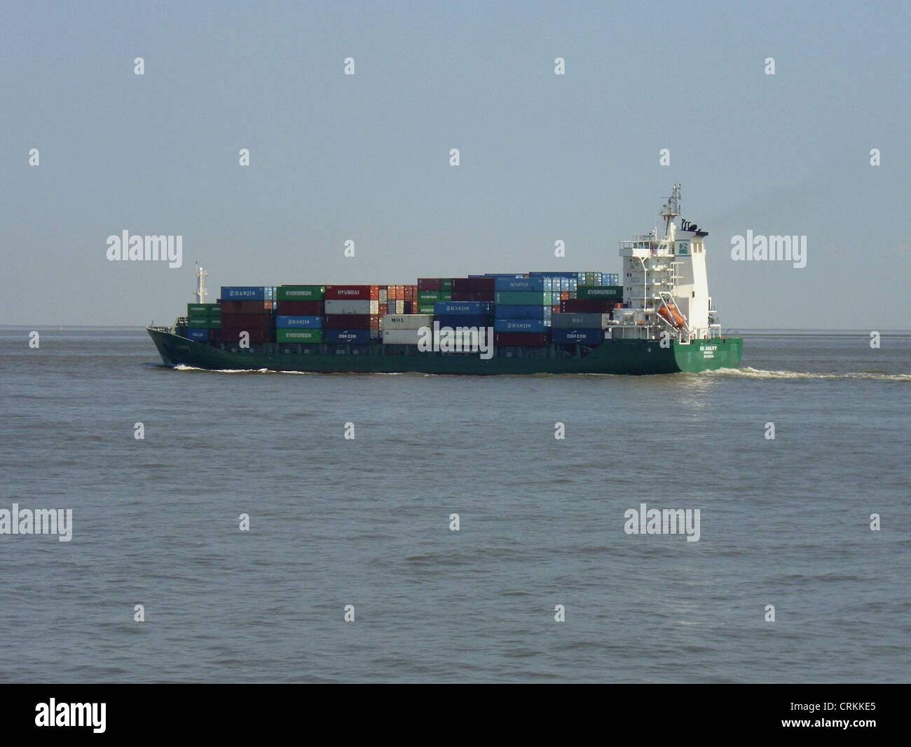 The feeder ship '''DS Agility''' outbound on the Elbe river Stock Photo