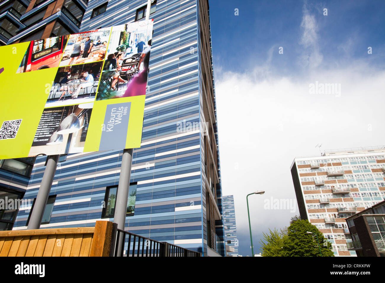 Contrast between old social high rise flats and new apartments in