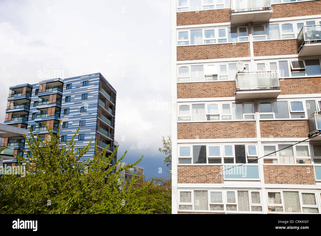 Contrast between old social high rise flats and new apartments in