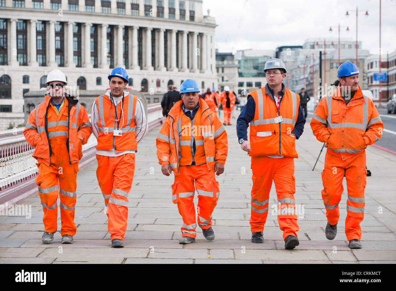 Workmen wearing full PPE (protective clothing) on blackfirars bridge in