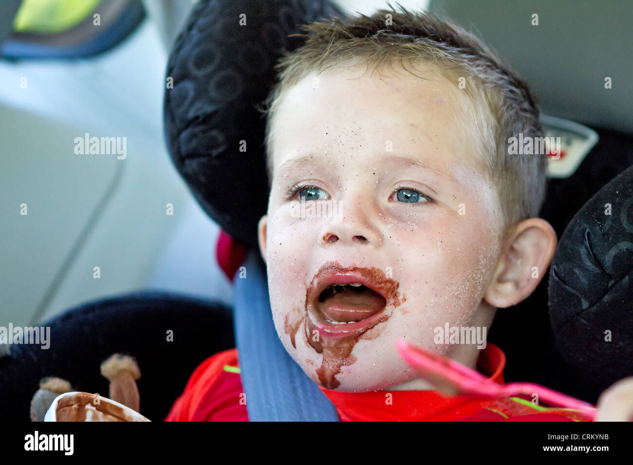 little boy eating a chocolate ice cream Stock Photo Alamy