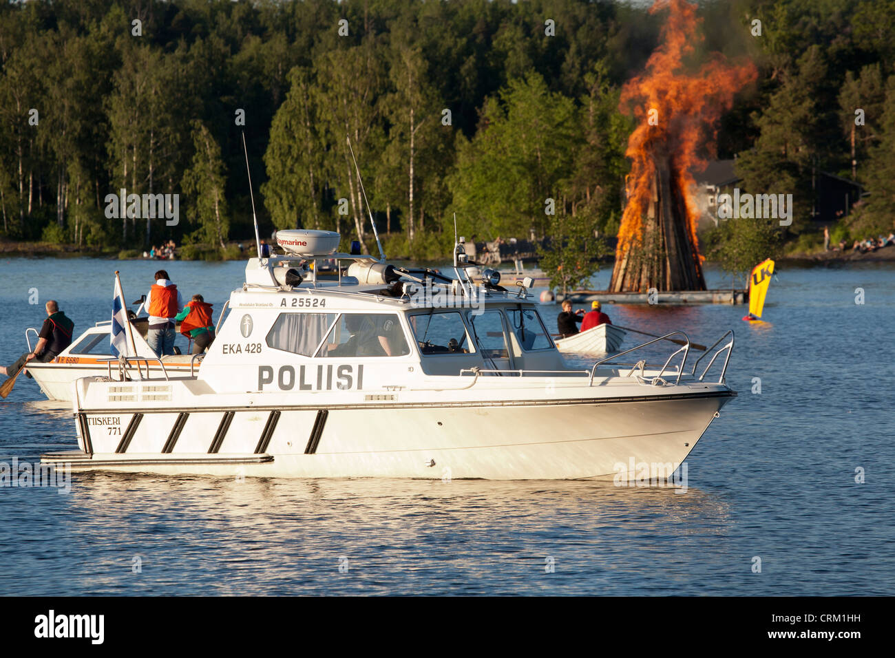 Police boat with Midsummer bonfire, Lappeenranta Finland Stock Photo