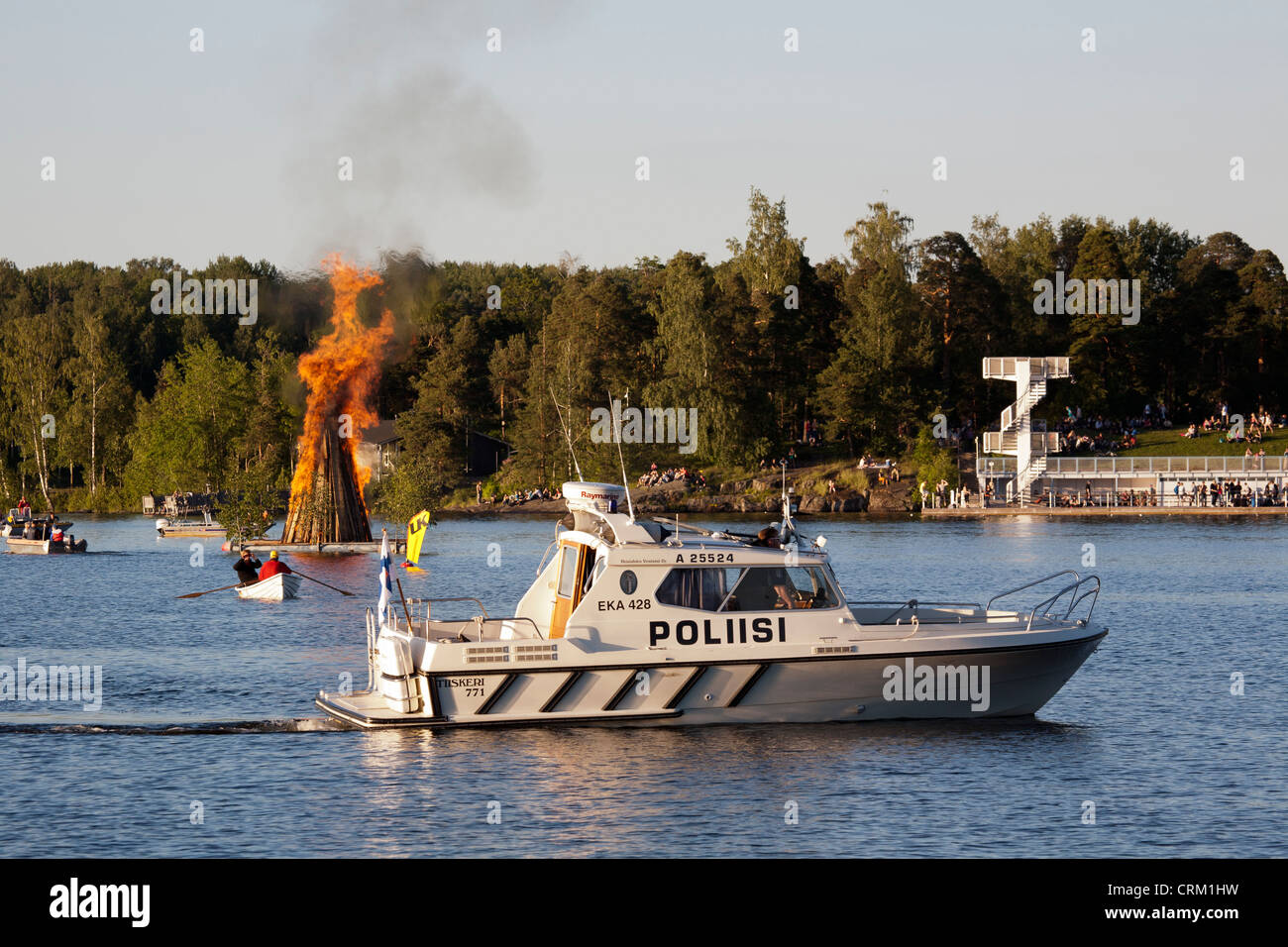 Police boat with Midsummer bonfire, Lappeenranta Finland Stock Photo