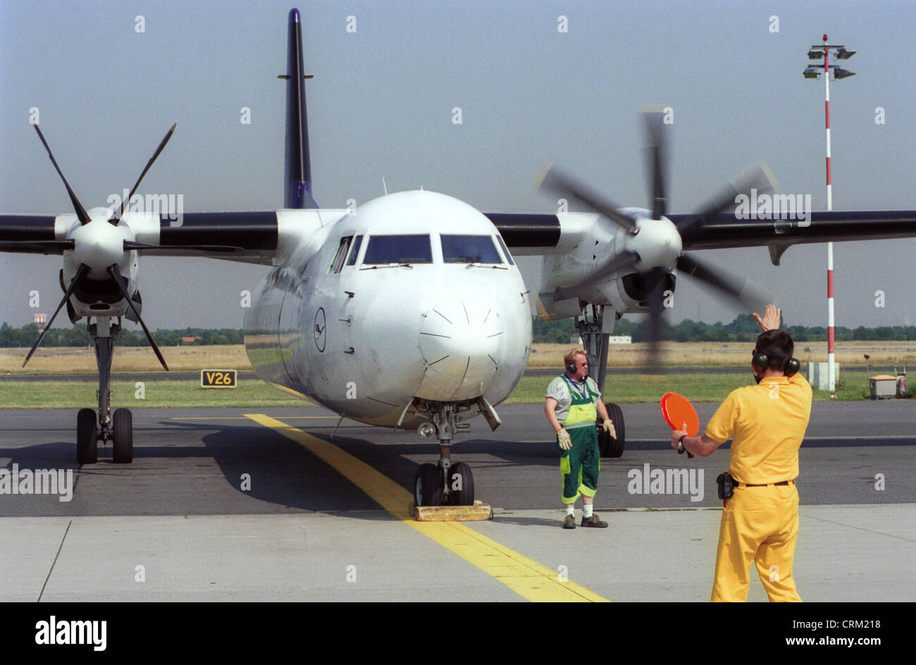 Aircraft is instructed to park position Stock Photo