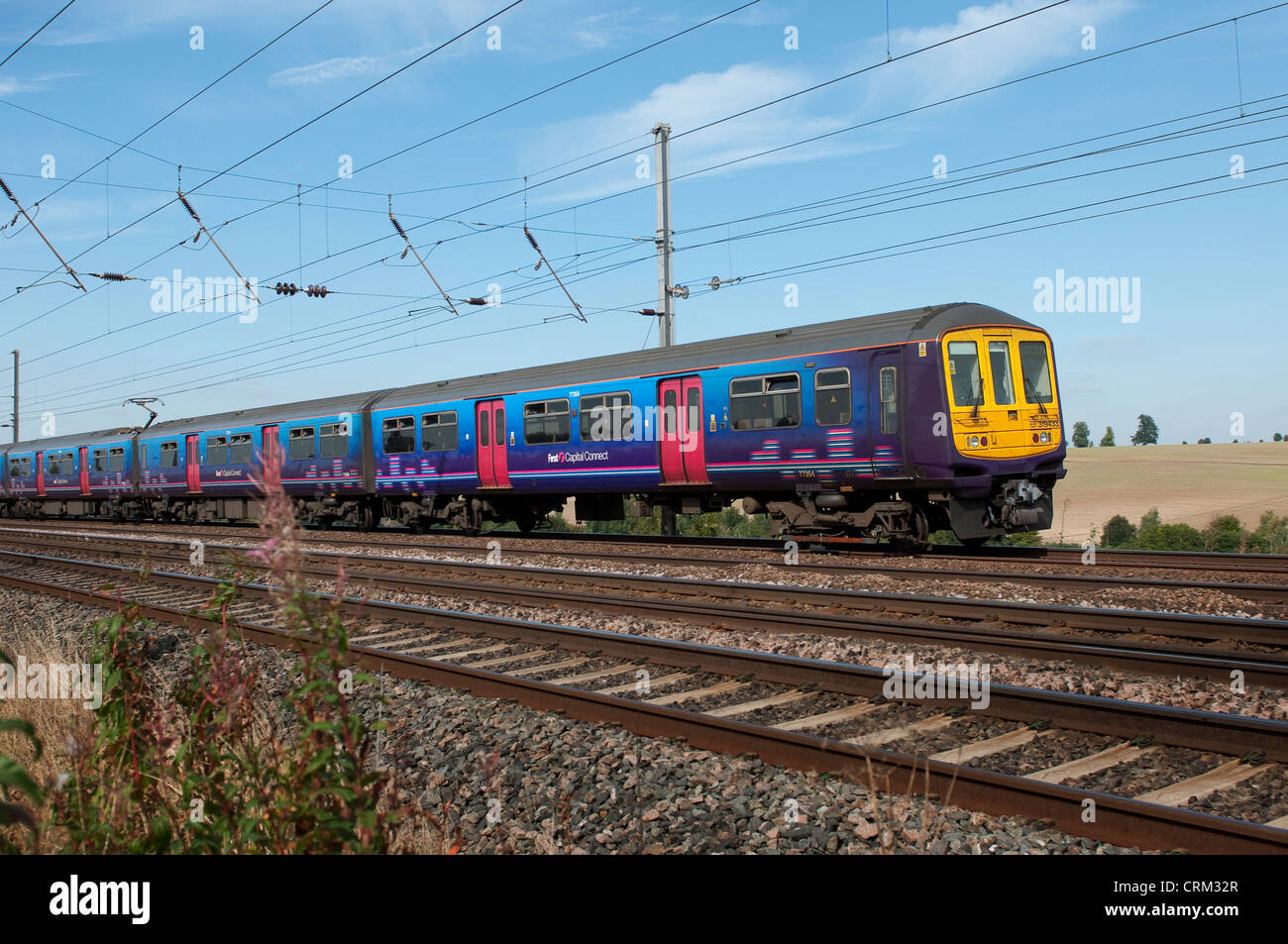 Passenger train in First Capital Connect livery speeding through the ...