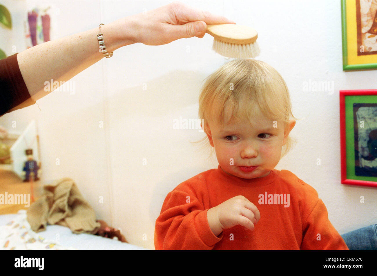 A boy's hair is combed Stock Photo Alamy