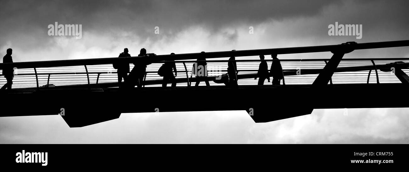 Silhouette of people Crossing Millennium Bridge Stock Photo - Alamy