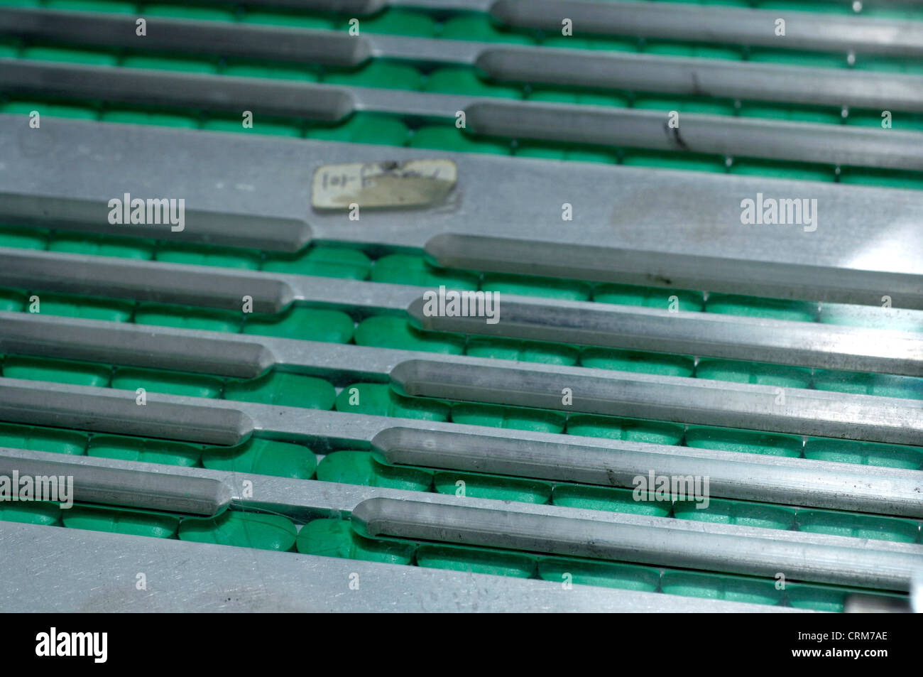 Tablets on a conveyor belt. Stock Photo