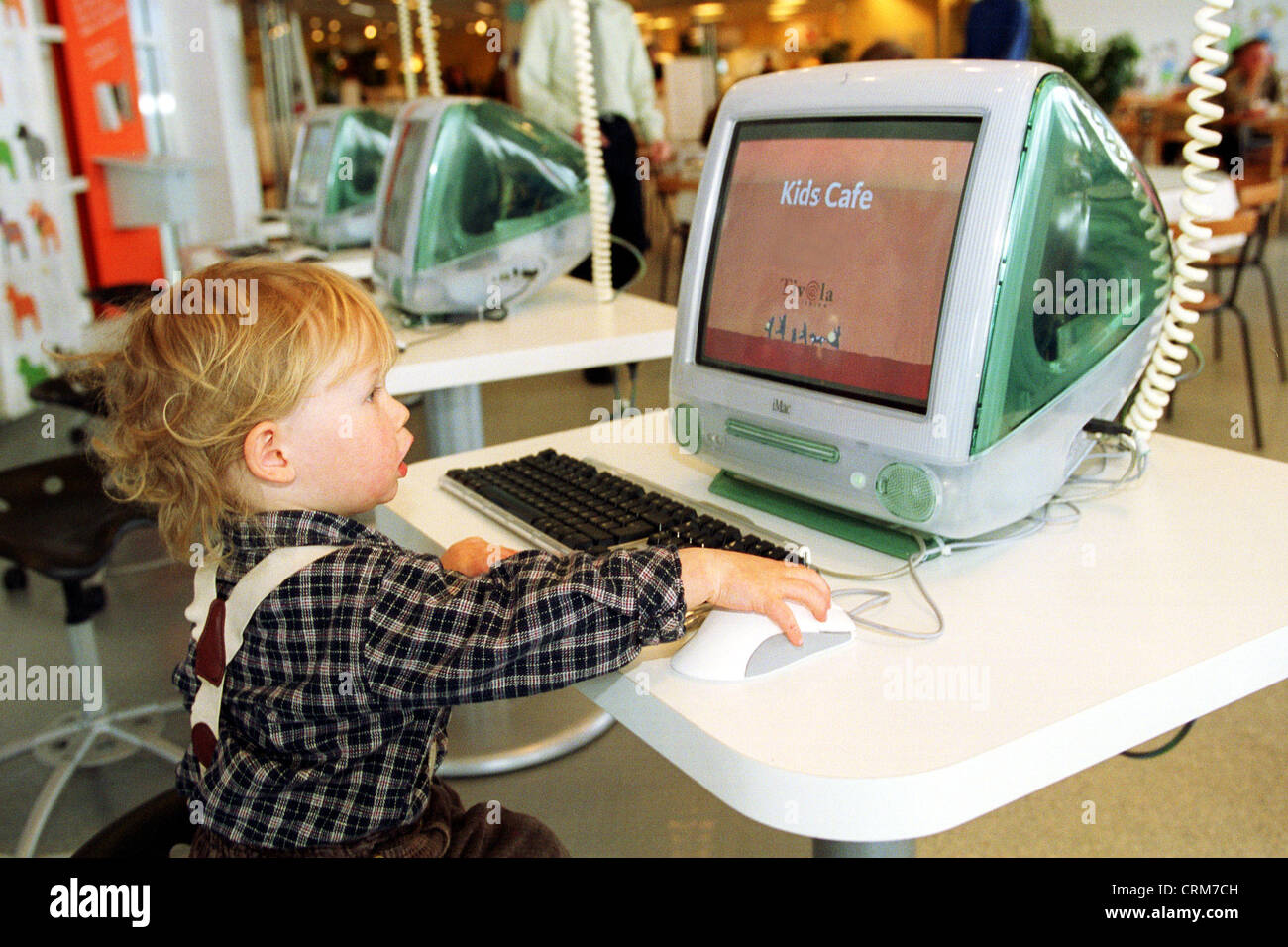 A little boy sits in front of a computer Stock Photo - Alamy