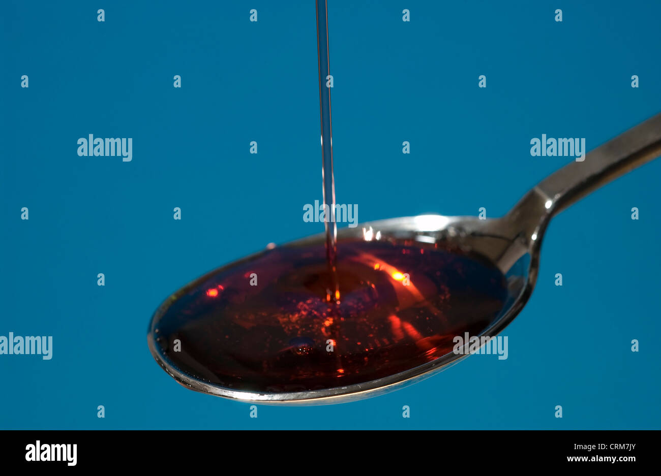 A spoonful of liquid medicine. Stock Photo