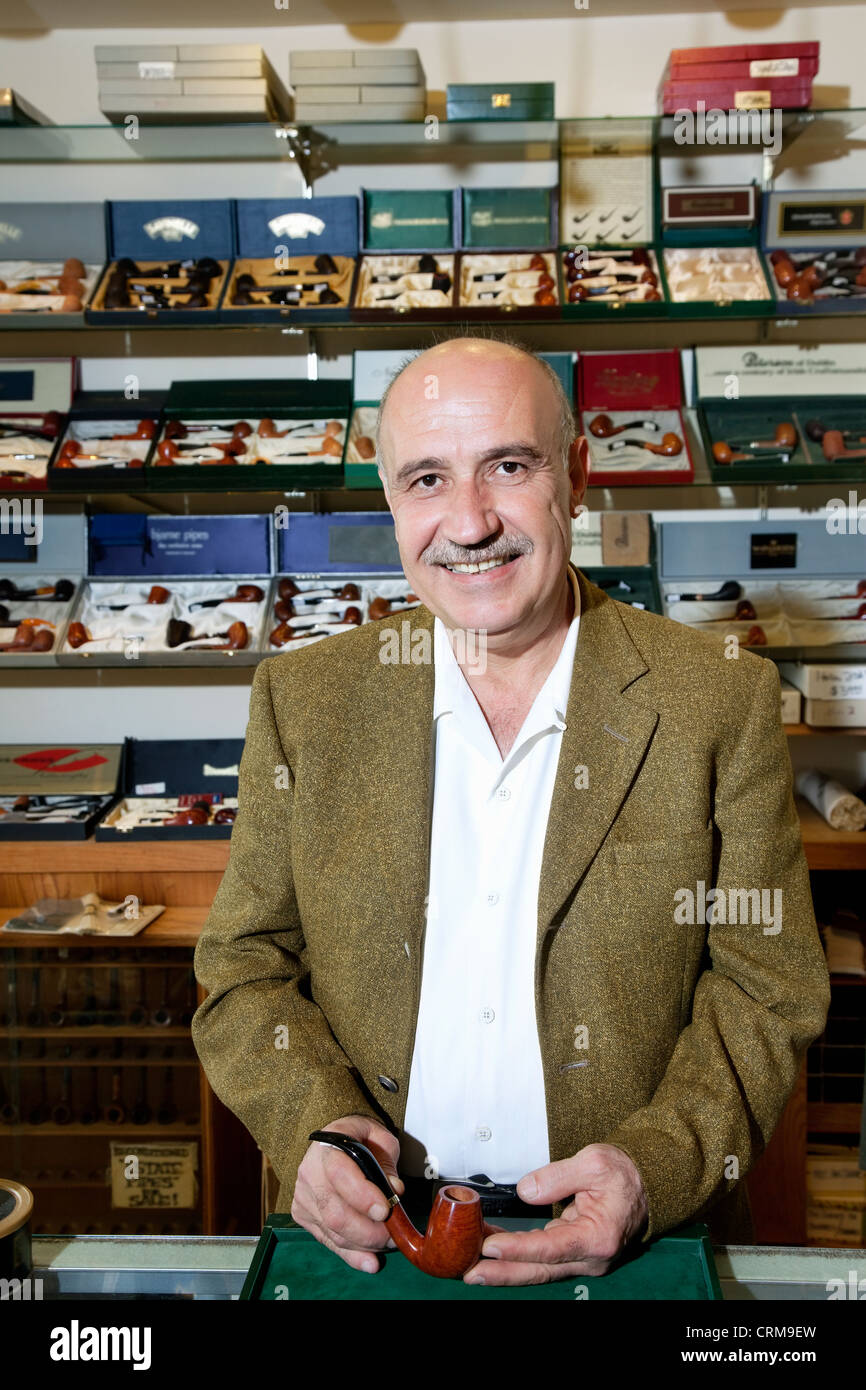 Portrait of a mature tobacco shop owner Stock Photo