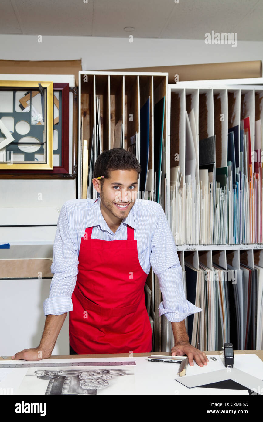 Portrait of a happy skilled worker in workshop Stock Photo