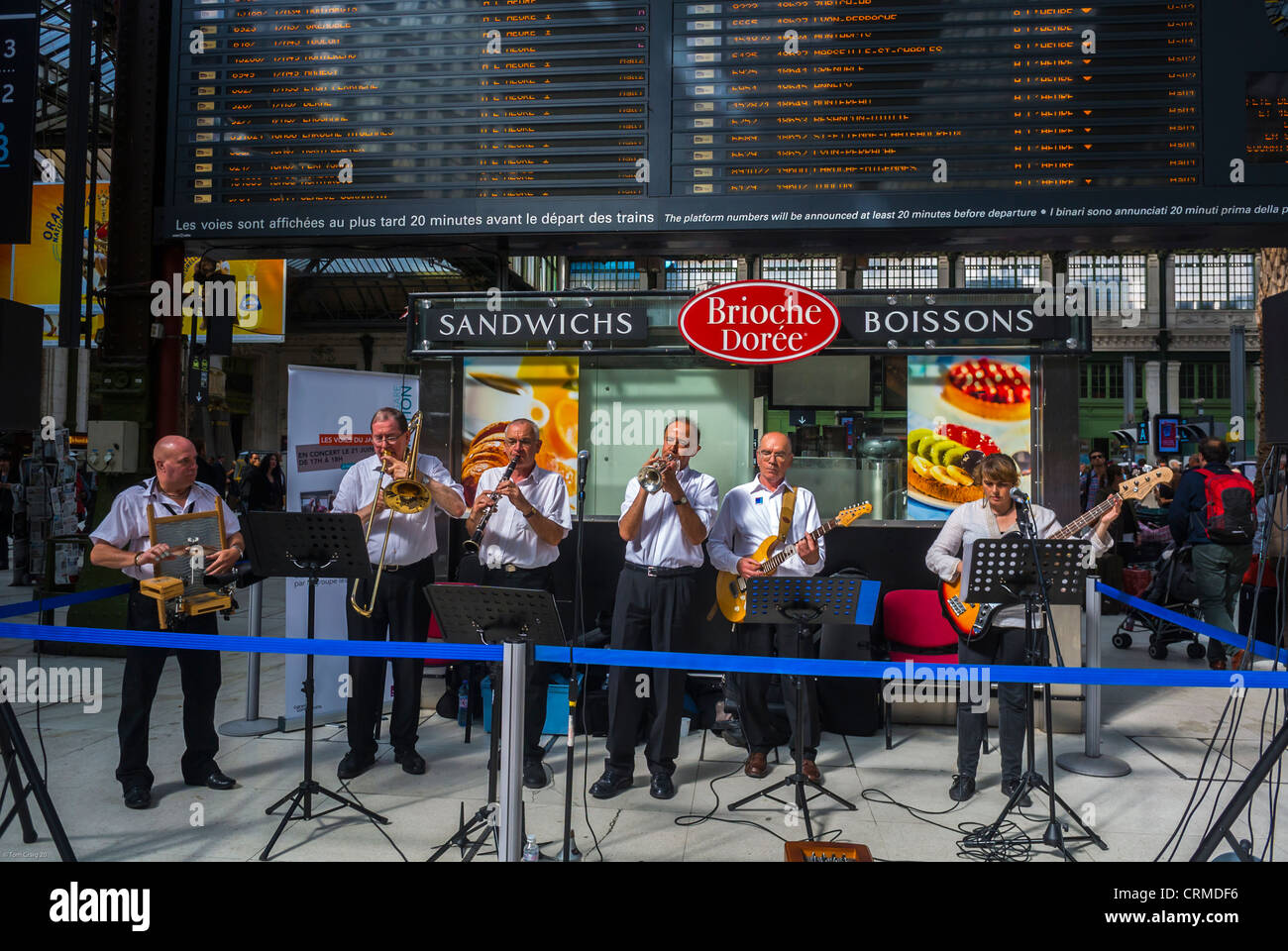 Paris, France, Group of Men, New Orleans Jazz Band, Orchestra Performing in Train Station, National Music Festival, 'Fete de la Musique', American Spring Jazz Band Music Concert Stock Photo