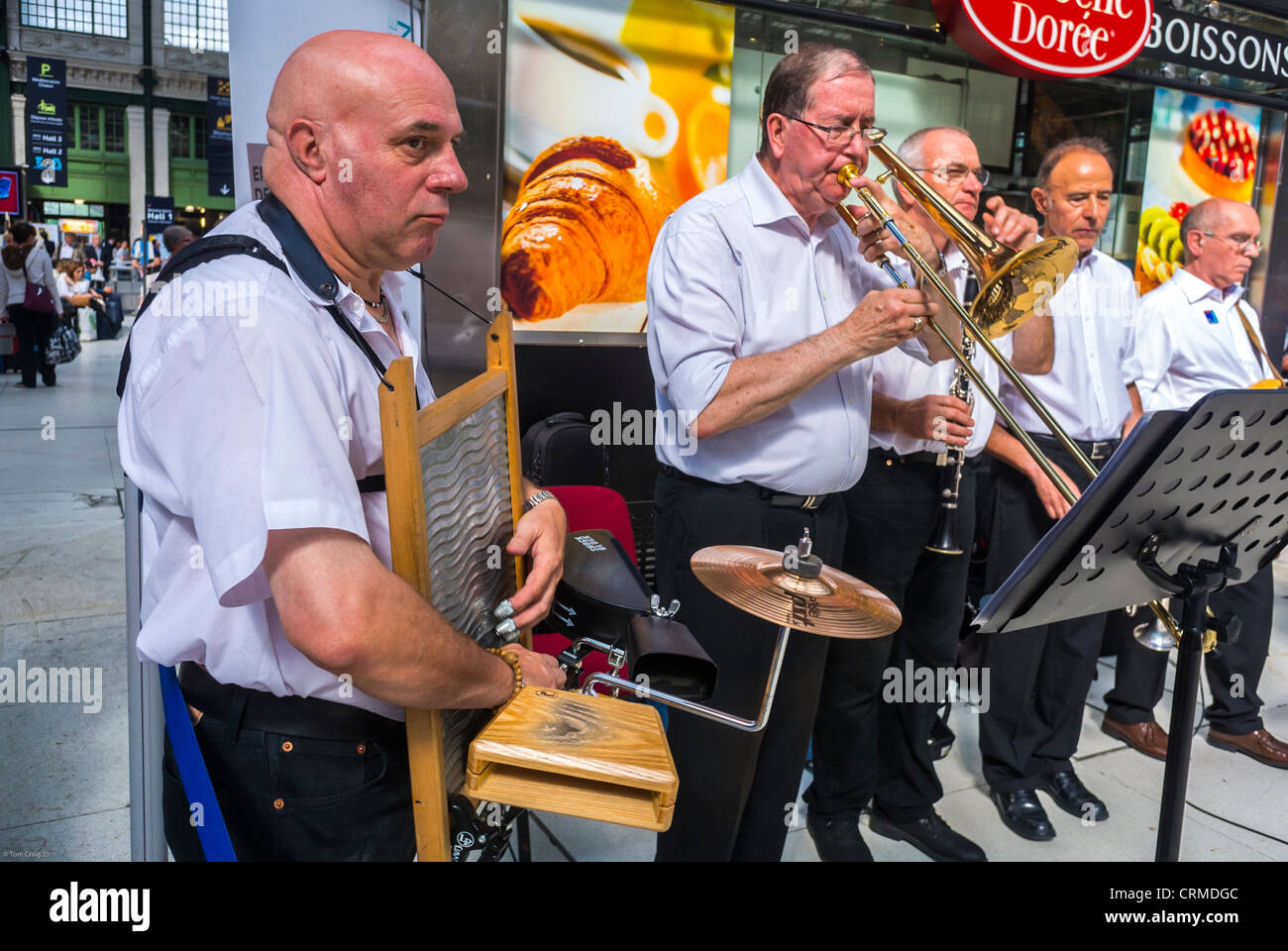 World Music Day, Paris, France, Group of Men, New Orleans Jazz Band, Orchestra Performing Train Station, National Music Festival, 'Fete de la Musique', American Spring Jazz Band Concert, elderly people make music together Stock Photo