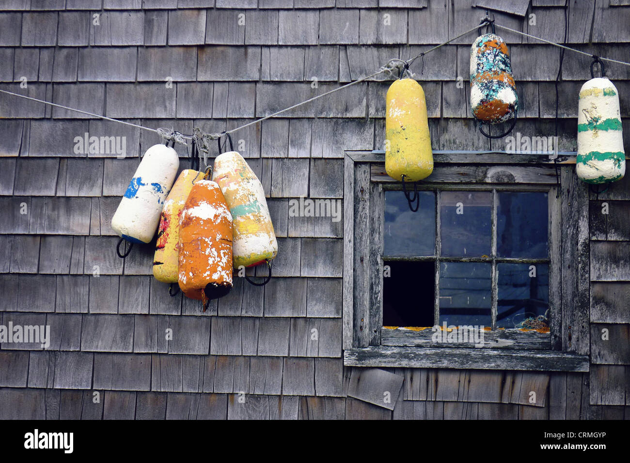 Buoys hanging on a house in Peggy's Cove. Nova Scotia Stock Photo