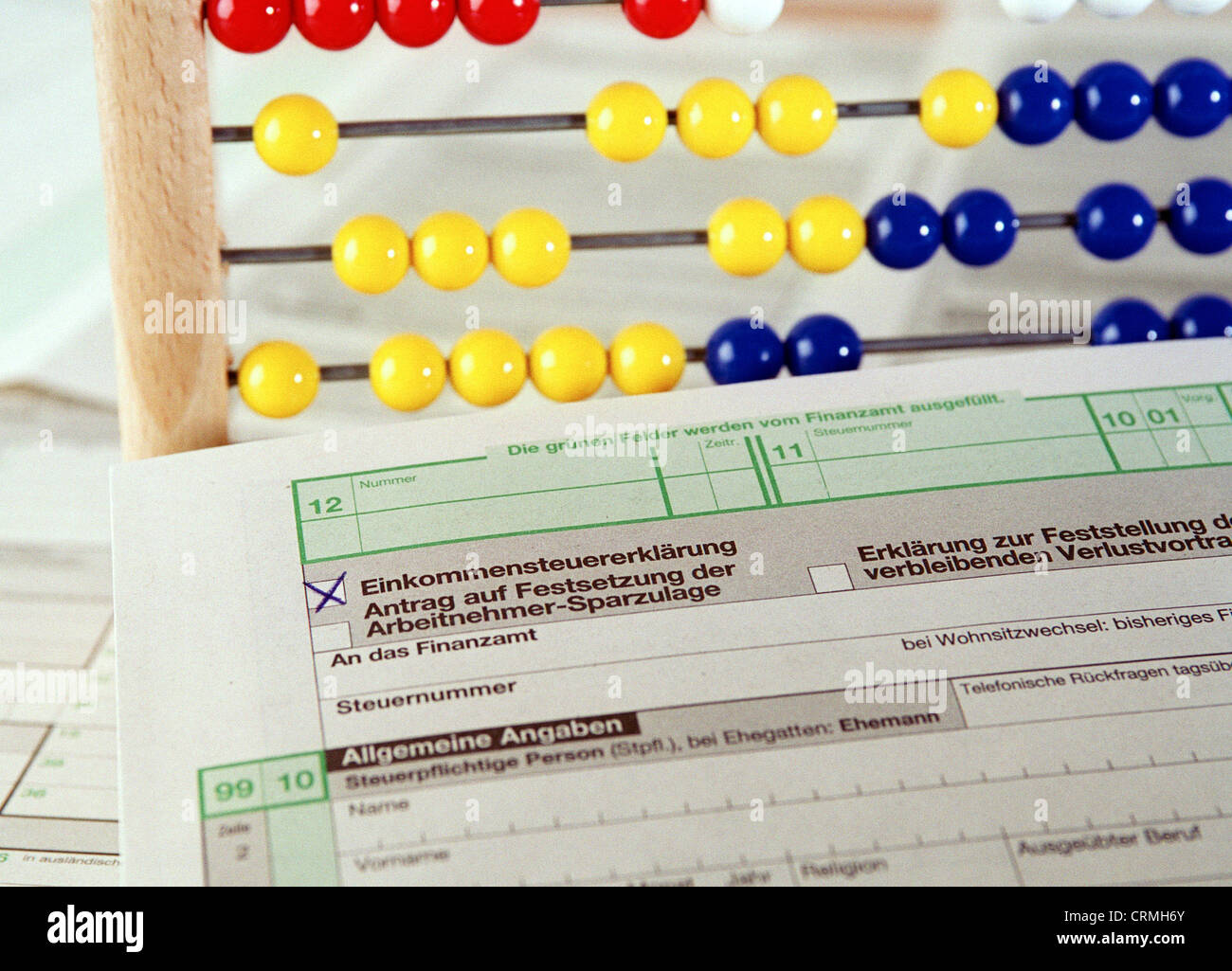 Form for income tax return and abacus Stock Photo